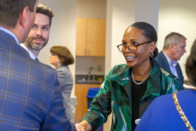 Dr. Ebony Boulware shaking hands with other professionals