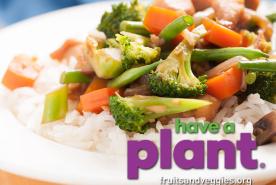 chicken and mixed vegetable stir fry over rice, have a plant logo
