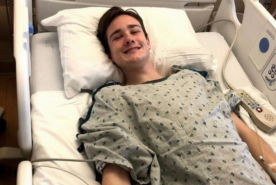 Dan O'Connell smiling in hospital bed