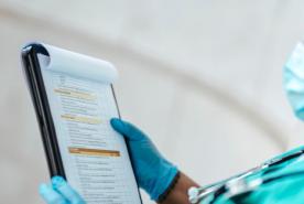 Healthcare provider looking at paperwork