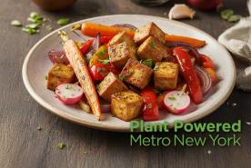 Glazed tofu and vegetables, with Plant Powered Metro New York logo