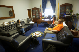 Two kidney advocates speaking with House of Representative aid