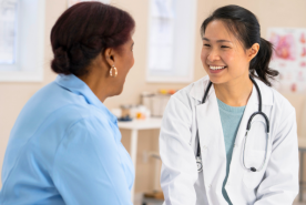 Doctor speaking with patient in office