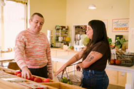 Couple grocery shopping together