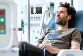 Adult in dialysis clinic chair