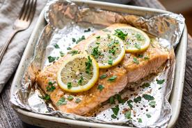 Tender baked salmon with garlic, lemon, herbs, parsley, and a light brown sugar glaze