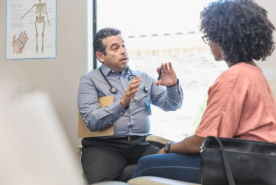 Doctor speaking with patient
