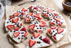 Frozen greek yogurt bark studded with strawberry slices and mini chocolate chips