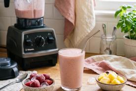 Strawberry Pineapple Smoothie on a counter top next to a blender
