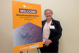 Heather Murphy with NKF Xenotransplant Roundtable sign