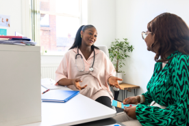Patient speaking with a smiling healthcare provider