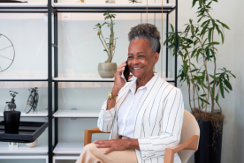 Older adult happily on phone call
