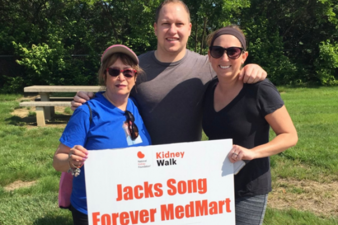 Erica Cohen and mom holding Kidney Walk sign that says "Jack Song Forever"