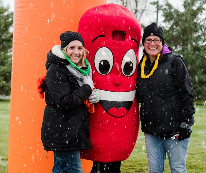 Laurie with Sidney the Kidney in the snow at Kidney Walk