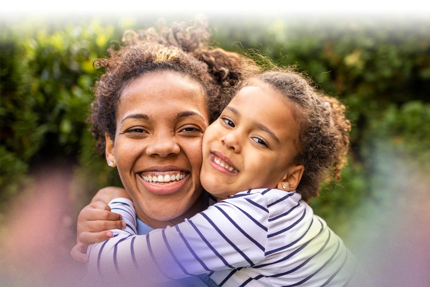 Mother and daughter hugging