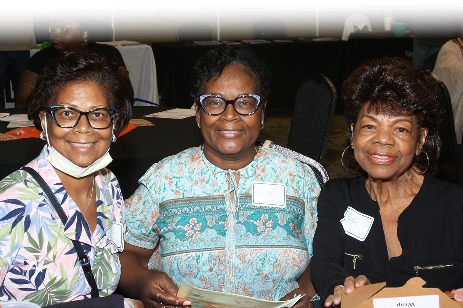 Group of women sitting at a table at an NKF Patient Symposium