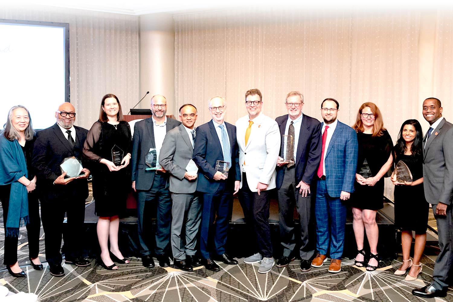 Group of award winners posing together at SCM25