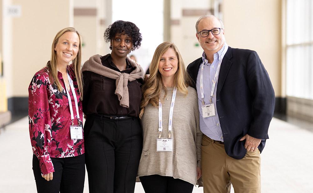 A group of professionals posing together at SCM