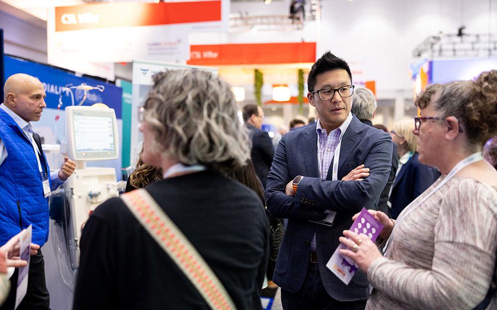 Group of professionals talking in SCM Expo hall