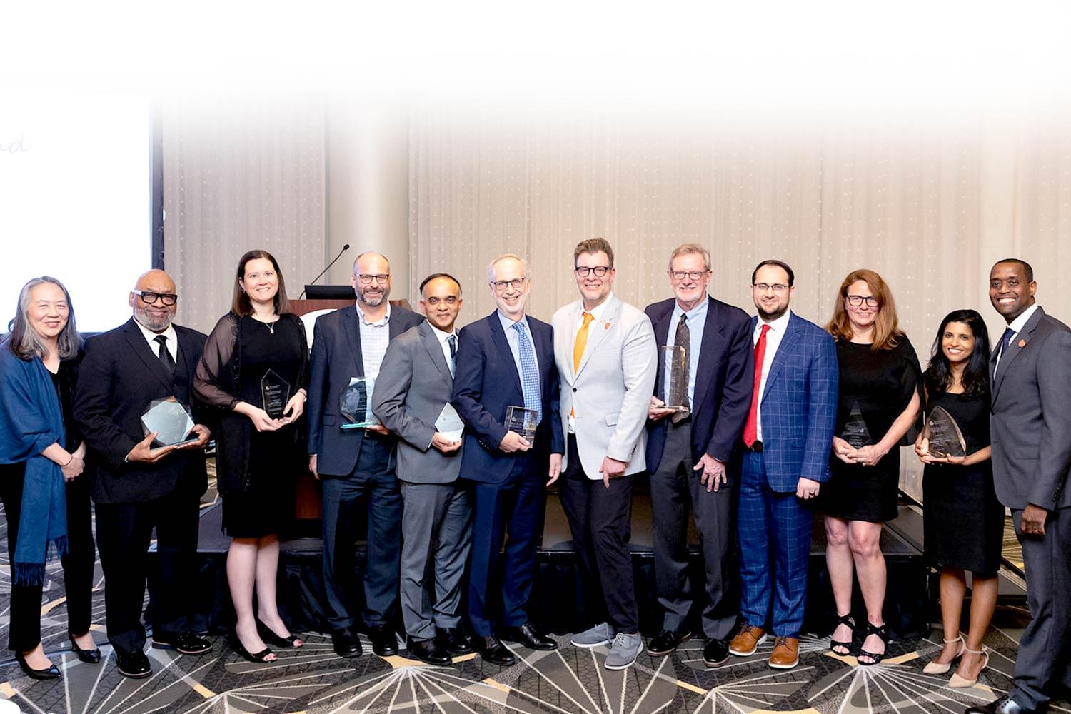 Group of award winners posing together at SCM25