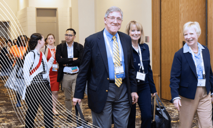 Group of SCM attendees walking down the hall