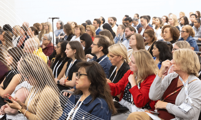 SCM attendees watching a speaker