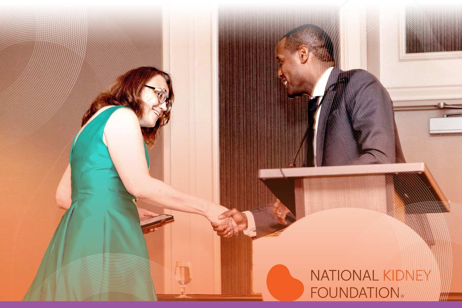 SCM award recipient receiving an award on stage