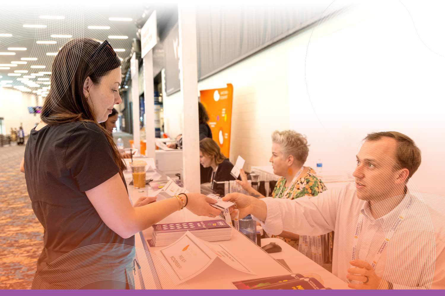 SCM attendees registering at the desk
