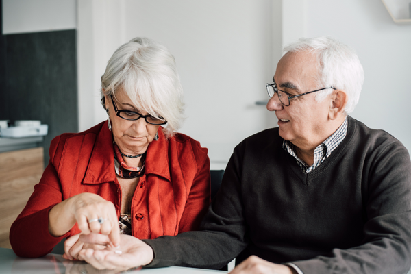 Person giving partner a pill