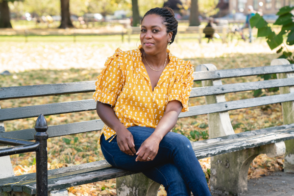 Maya Feller, RD, sitting outside