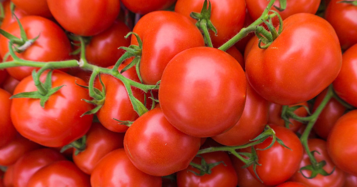 stack of small red tomatoes