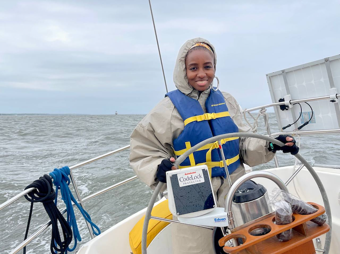 Vaunita Goodman driving a boat